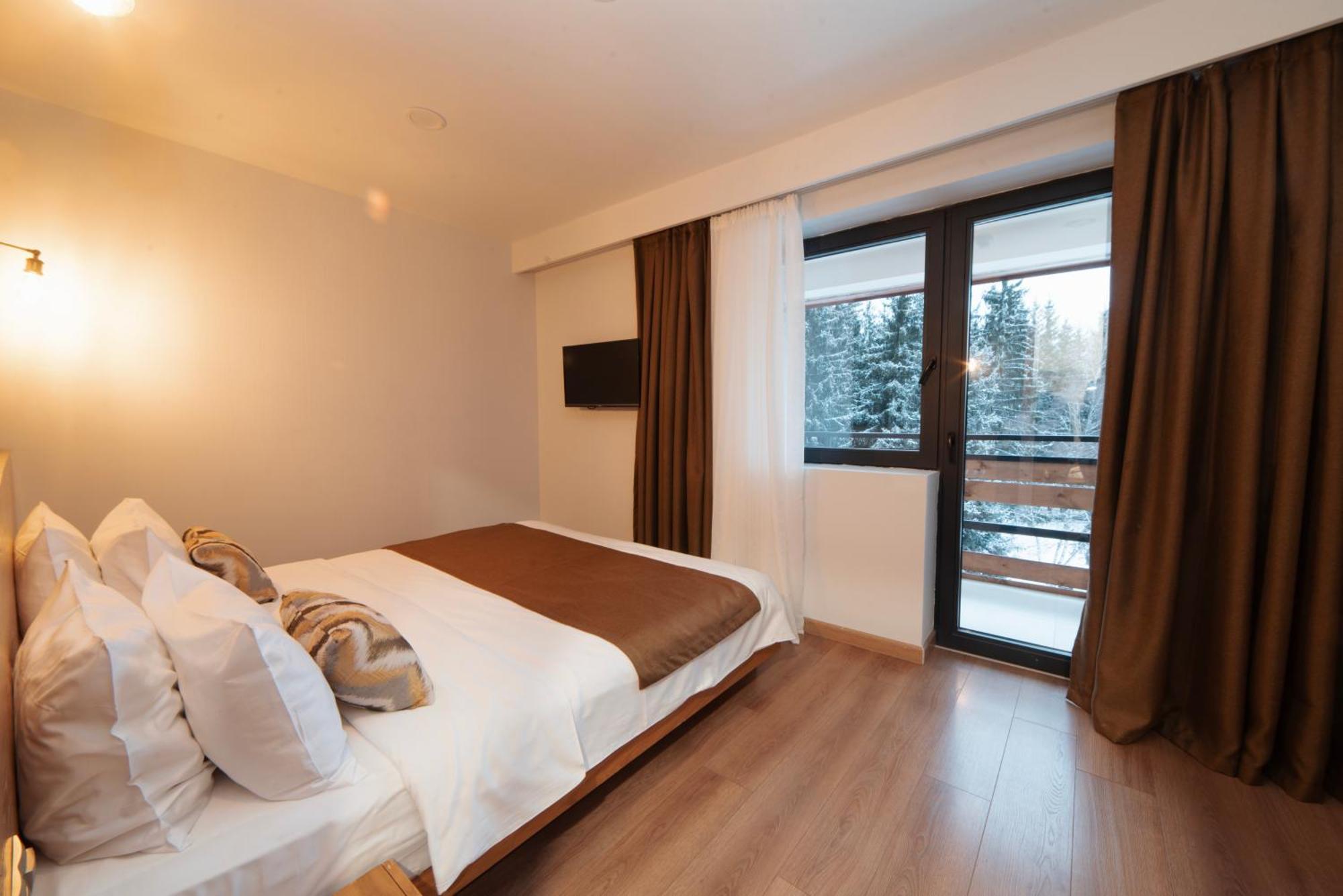 Bakuriani Inn Pokój zdjęcie A bedroom in a hotel